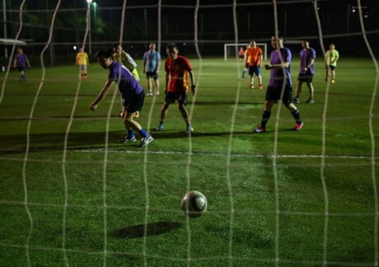 Covid-19: à Wuhan, les fans de foot rechaussent les crampons