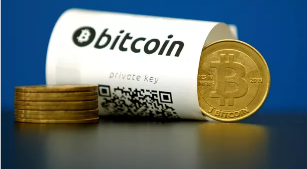 Le bitcoin dépasse son sommet historique et approche des 20.000 dollars